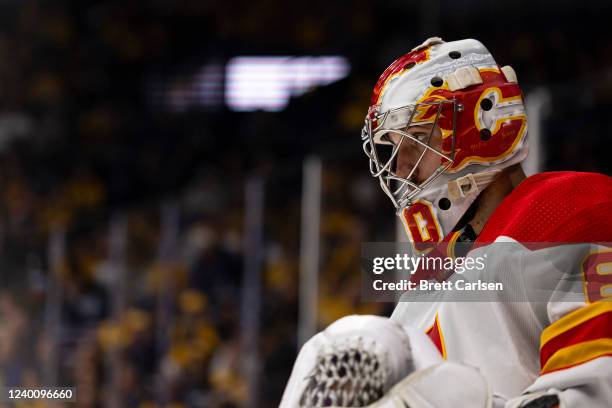 Dan Vladar of the Calgary Flames skates out of the net during a stoppage in play against the Nashville Predators during the first period at...