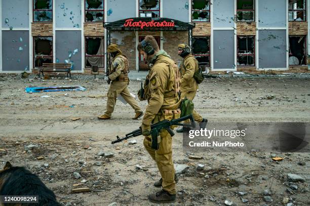 Ukrainian soldiers patrol in the frontline of Mykolaiv surrounded of the destruction after the russian shelling over a village, Ukraine.