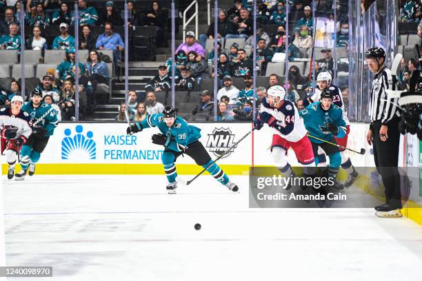 Logan Couture races towards the puck in game against the Columbus Blue Jackets at SAP Center on April 19, 2022 in San Jose, California.