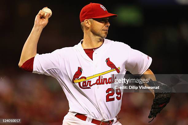 Starter Chris Carpenter of the St. Louis Cardinals throws to first base against the Milwaukee Brewers at Busch Stadium on September 7, 2011 in St....