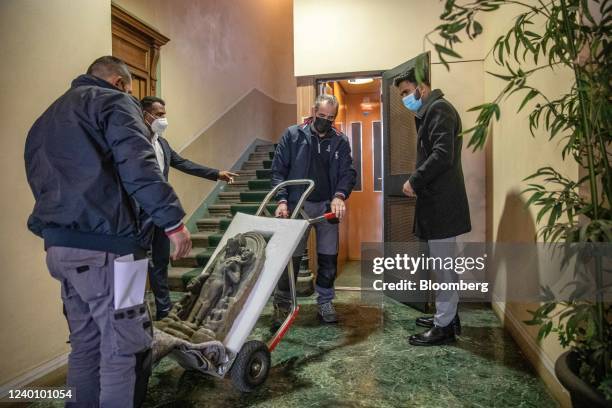 Movers deliver a statue to the Consulate General of India for repatriation in Milan, Italy, on Thursday, Feb 10, 2022. Amid tense disagreements over...