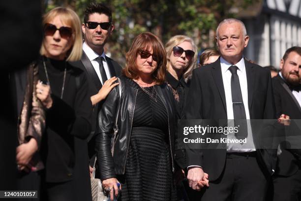 Parents of Tom Parker, Noreen Parker , Nigel Parker and wife of Tom Parker, Kelsey Parker , follow a horse-drawn hearse during a procession through...