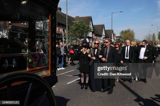 Wife of Tom Parker, Kelsey Parker , follows a horse-drawn hearse during a procession through Orpington before a funeral service at St Francis of...