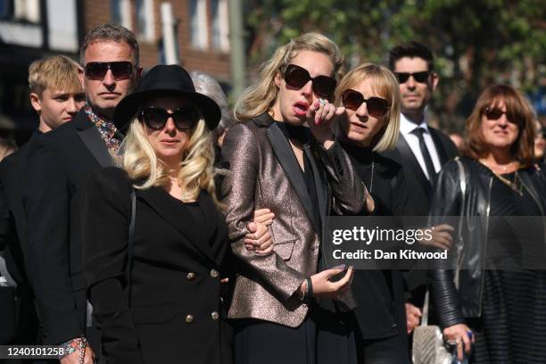 Wife of Tom Parker, Kelsey Parker , follows a horse-drawn hearse during a procession through Orpington before a funeral service at St Francis of...