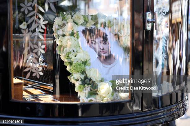 Picture of Tom Parker is seen on a horse-drawn hearse during a procession through Orpington before a funeral service at St Francis of Assisi church...