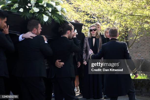 Wife of Tom Parker, Kelsey Parker , looks on as the coffin is carried into St Francis of Assisi church before a funeral service on April 20, 2022 in...