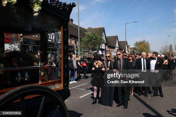 Wife of Tom Parker, Kelsey Parker , follows a horse-drawn hearse during a procession through Orpington before a funeral service at St Francis of...