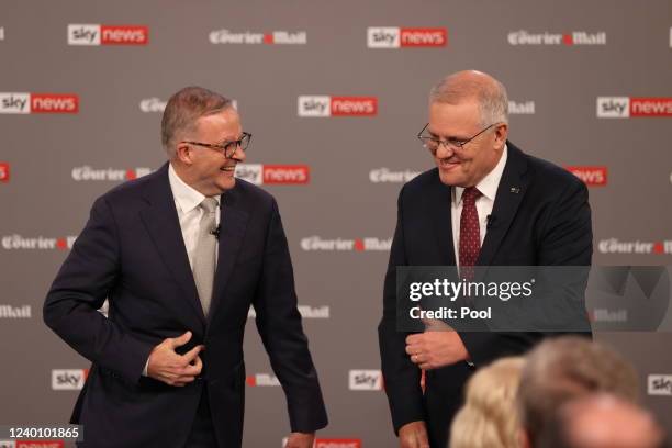 Leader of the Opposition Anthony Albanese and Australian Prime Minister Scott Morrison react during the first leaders' debate of the 2022 federal...