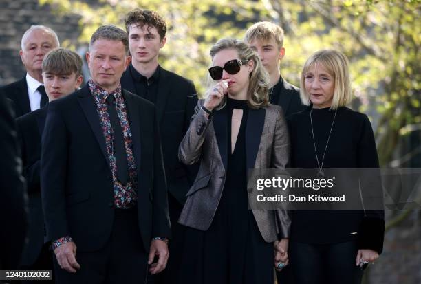 Wife of Tom Parker, Kelsey Parker , looks on as the coffin is carried into St Francis of Assisi church before a funeral service on April 20, 2022 in...