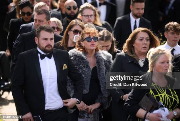 Mourners leave St Francis of Assisi church following a funeral service for Tom Parker on April 20, 2022 in Orpington, England. British singer Tom...