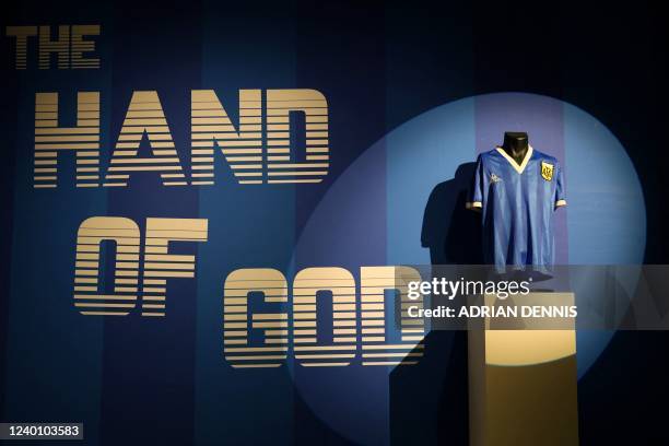 Football shirt worn by Argentina's Diego Maradona during the 1986 World Cup quarter-final match against England, is pictured during a photocall at...