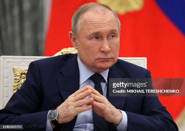 Russian President Vladimir Putin joins his hands as he holds a meeting of the Russia - Land of Opportunity platform supervisory board at the...