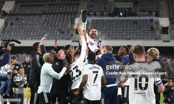 Fulham's Aleksandar Mitrovic is lifted up as the team celebrate during the Sky Bet Championship match between Fulham and Preston North End at Craven...