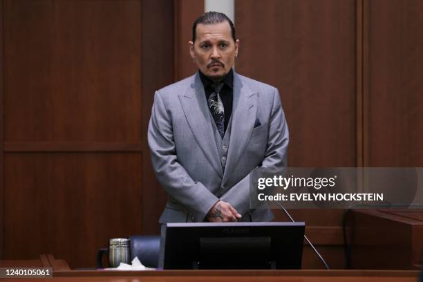 Actor Johnny Depp takes a stand during his defamation trial against his ex-wife Amber Heard at the Fairfax County Circuit Courthouse in Fairfax,...