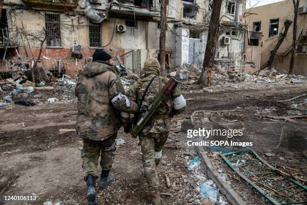 Russian and Chechen soldiers in a devastated Mariupol neighborhood close to the Azovstal frontline. The battle between Russian / Pro Russian forces...