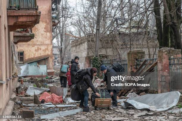 Civilians prepare to evacuate through the rubble from a frontline neighborhood in eastern Mariupol. The battle between Russian / Pro Russian forces...