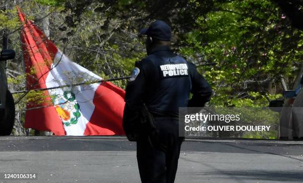 Police officer patrols near the house of the Peruvian ambassador, in Washington, DC, on April 20, 2022. - A man who broke into the compound of Perus...