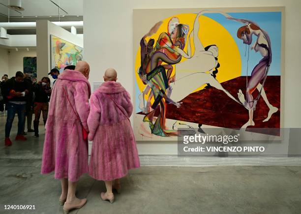 Visitors view "Don't let it bring yew down" by US artist Christina Quarles, during a press day at the 59th Venice Art Biennale in Venice on April 20,...