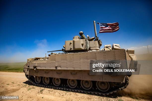 Bradley Fighting Vehicle patrols the countryside of the Kurdish-majority city of Qamishli in Syria's northeastern Hasakeh province, on April 20, 2022.