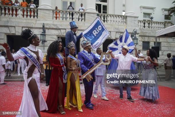 King Momo Wilson Dias da Costa Neto dances after receiving the keys to the city of Rio from from Rio's mayor Eduardo Paes during the official opening...