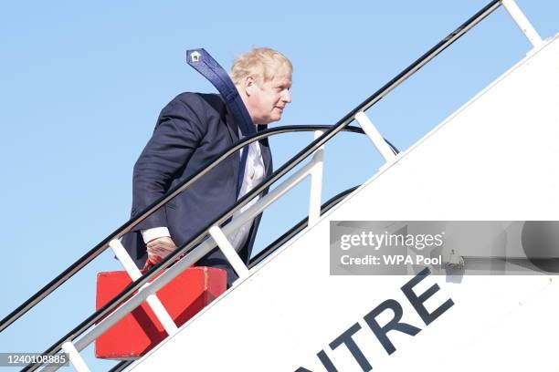Prime minister Boris Johnson boards a plane at Stansted Airport for a visit to India, on April 20, 2022 in Stansted, England. Boris Johnson is...