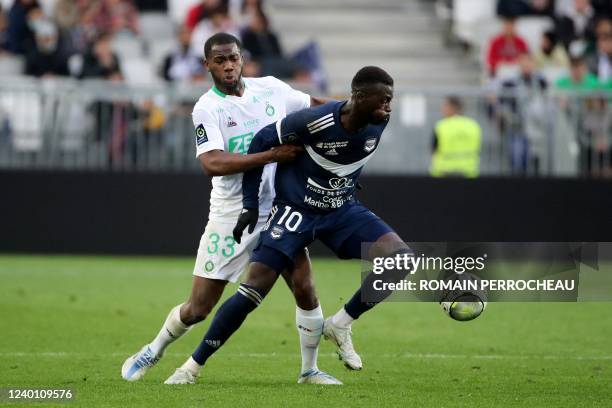 Bordeaux' French forward Mbaye Niang fights for the ball with Saint-Etienne's Ivorian defender Abdoulaye Bakayoko during the French L1 football match...