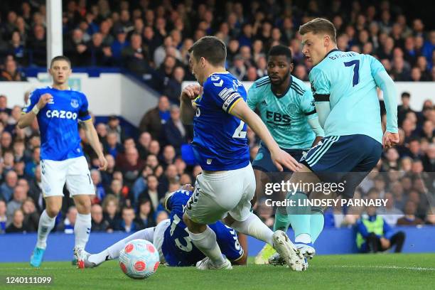 Leicester City's English midfielder Harvey Barnes shoots to score the opening goal of the English Premier League football match between Everton and...