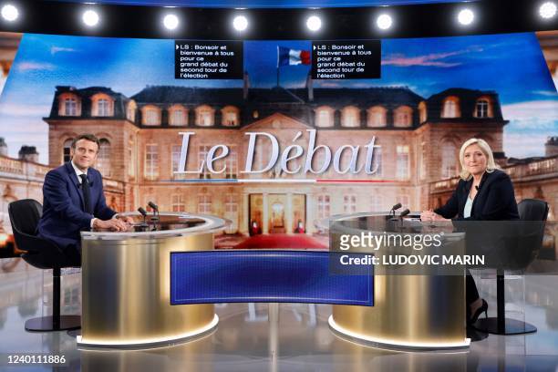 French President and La Republique en Marche party candidate for re-election Emmanuel Macron and French far-right party Rassemblement National...