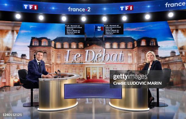 French President and La Republique en Marche party candidate for re-election Emmanuel Macron and French far-right party Rassemblement National...