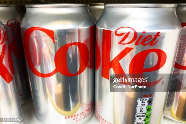 Diet Coke cans are seen in a store in Poland on April 19, 2022.