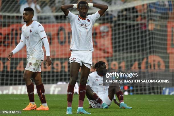 Metz's Senegalese midfielder Pape Matar Sarr reacts at the end of the French L1 football match between FC Lorient and FC Metz at the Moustoir stadium...