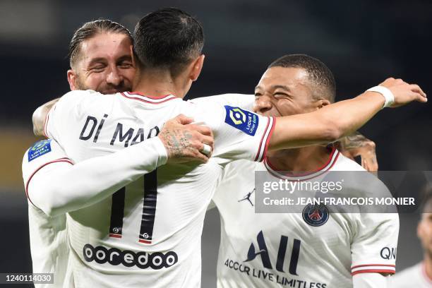 Paris Saint-Germain's Spanish defender Sergio Ramos celebrates with Paris Saint-Germain's Argentinian midfielder Angel Di Maria and Paris...