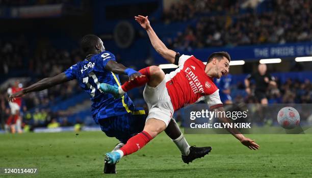 Arsenal's German-born Portuguese defender Cedric Soares vies with Chelsea's French defender Malang Sarr during the English Premier League football...