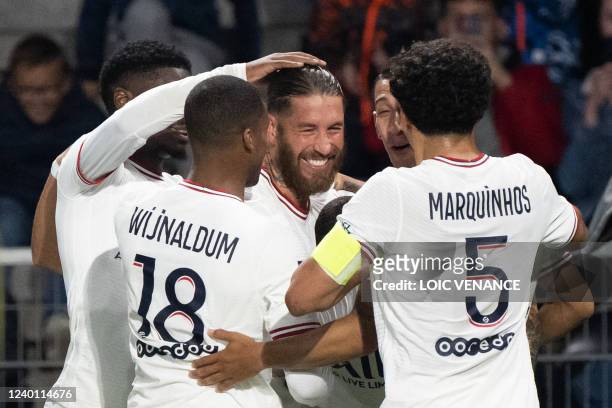 Paris Saint-Germain's Spanish defender Sergio Ramos celebrates with Paris Saint-Germain's Dutch midfielder Georginio Wijnaldum and Paris...