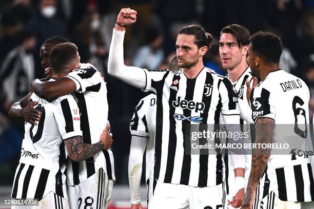 Juventus' French midfielder Adrien Rabiot celebrates after scoring during the Italian Cup semifinal, second leg football match between Juventus and...