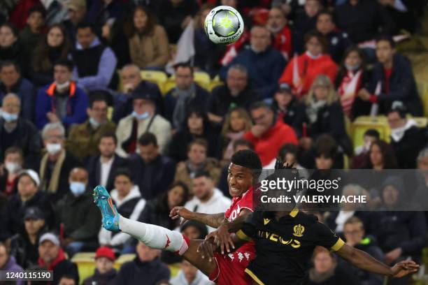 Monaco's Dutch forward Myron Boadu is challenged by Nice's Swiss defender Jordan Lotomba during the French L1 football match between AS Monaco and...