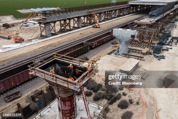 Contractors work on the Conejo Viaduct during construction of a high-speed rail project in Fresno County, California, U.S., on Monday, April 2022....