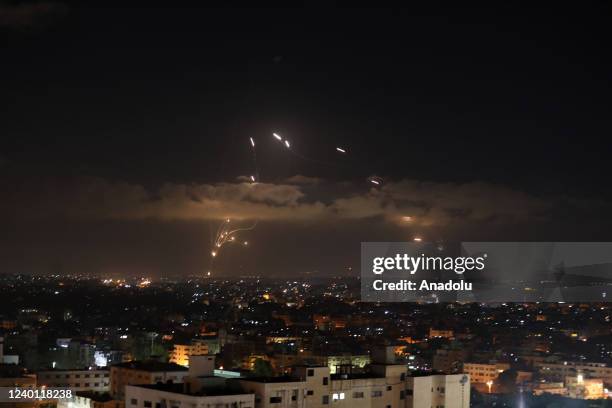 Israel's air defence system Iron Dome intercepts missiles launched from Gaza City, after Israeli warplanes carried out airstrikes at the site...