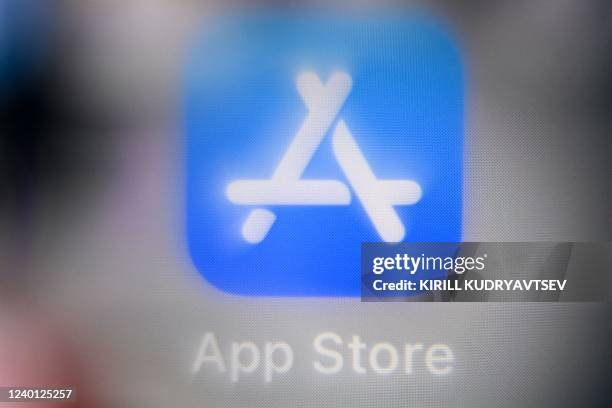 An illustration picture taken on April 21, 2022 in Moscow shows a smart phone screen bearing the App store application logo.