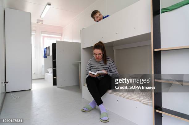 Ukrainian refugees are seen inside a temporary house at the settlement for displaced Ukrainians. The Polish government provided houses for Ukraine...