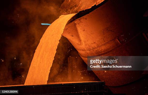 Workers pour ductile iron casting molten iron into a mould at the Siempelkamp Giesserei foundry on April 21, 2022 in Krefeld, Germany. The...