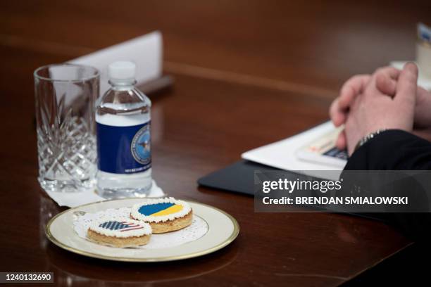 Cookies with the US and Ukrainian flags are set on a table before a meeting between Ukraine's Prime Minister Denys Shmyhal and US Secretary of...