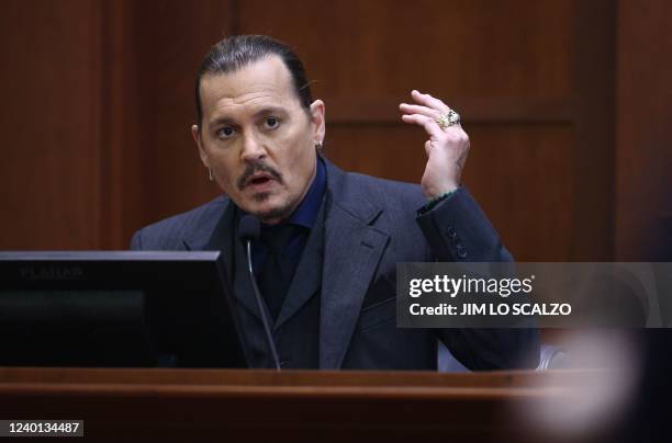 Actor Johnny Depp testifies during the 50 million US dollar Depp vs Heard defamation trial at the Fairfax County Circuit Court in Fairfax, Virginia,...