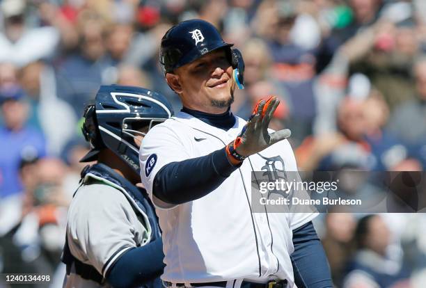 Miguel Cabrera of the Detroit Tigers gestures to the first base umpire after he was called out after failing to check his swing on strike three...