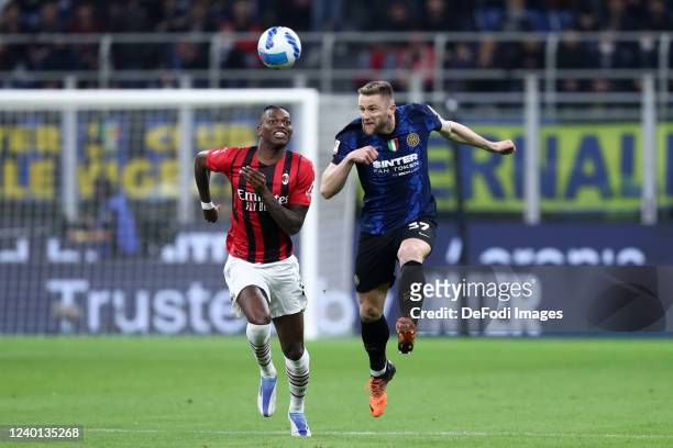 Milan Skriniar of FC Internazionale and Rafael Leao of AC Milan battle for the ball during the Coppa Italia Semi Final 2nd Leg match between FC...