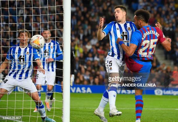 Barcelona's Gabonese midfielder Pierre-Emerick Aubameyang scores the opening goal during the Spanish League football match between Real Sociedad and...