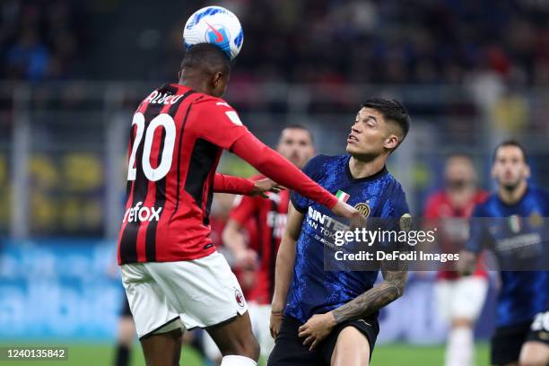 Pierre Kalulu of AC Milan and Joaquin Correa of FC Internazionale battle for the ball during the Coppa Italia Semi Final 2nd Leg match between FC...