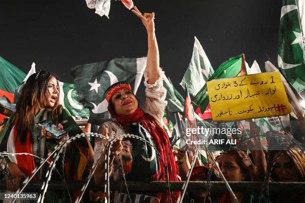 Supporters of Pakistan Tehreek-e-Insaf party, of former Pakistan's prime minister Imran Khan, shout slogans as they listen to a speech of the party...