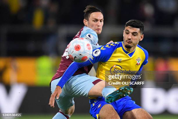 Burnley's Welsh defender Connor Roberts vies with Southampton's English-born Albanian striker Armando Broja during the English Premier League...