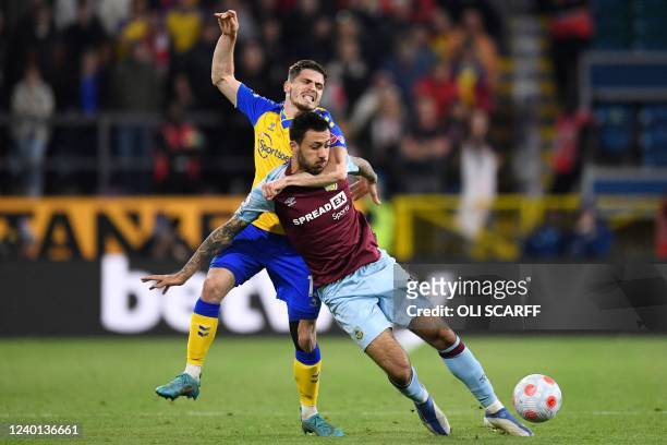 Southampton's French defender Romain Perraud vies with Burnley's English midfielder Dwight McNeil during the English Premier League football match...